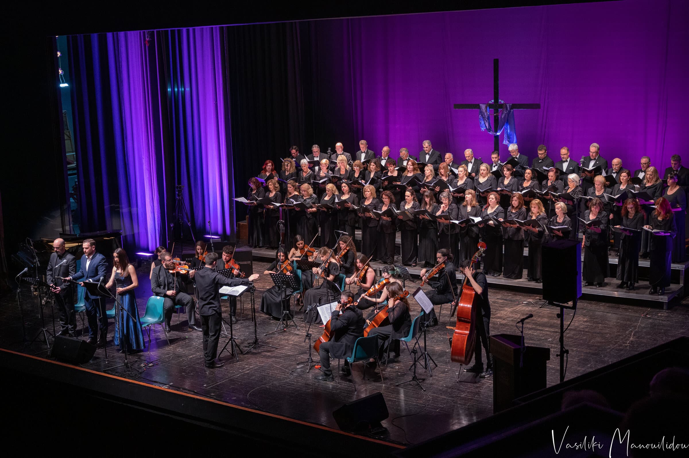 Vaggelis Stavropoulos conducting an orchestra and choir in concert